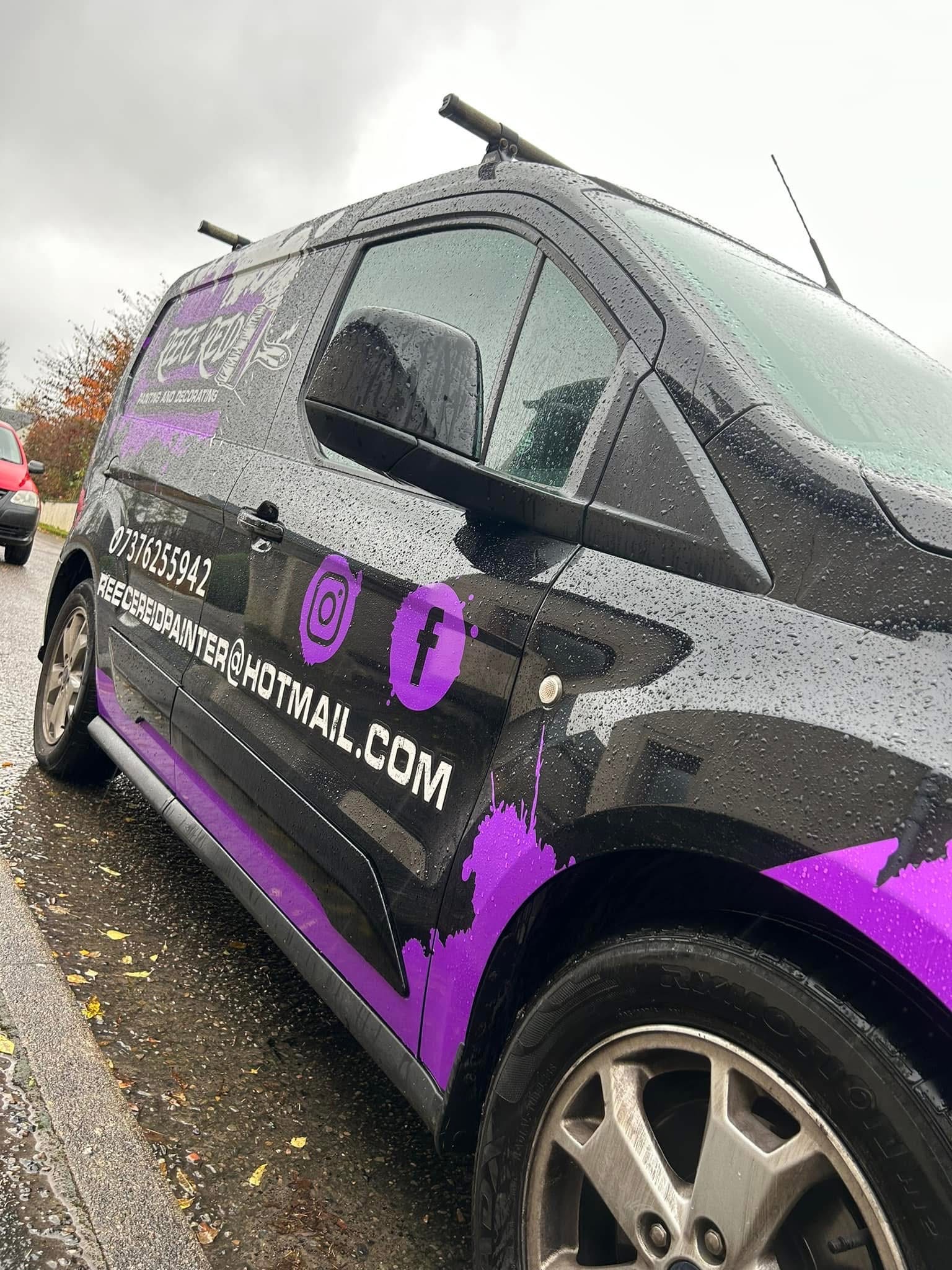 Close front-side view of the Reece Reid van graphics