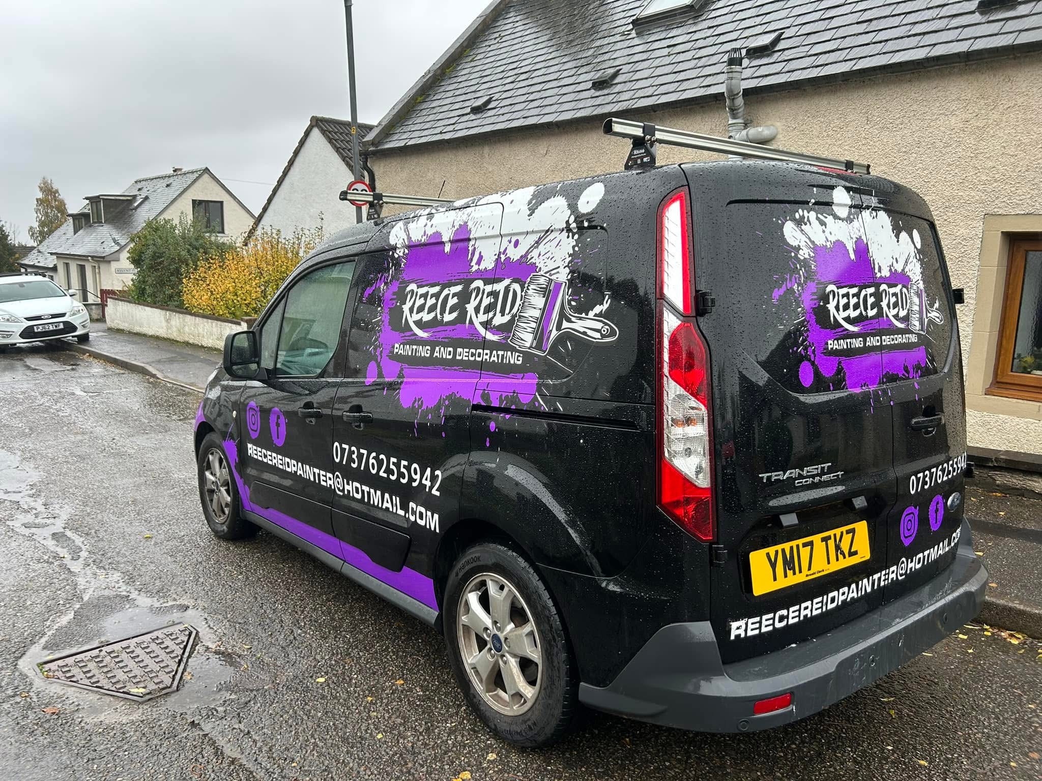 The completed Reece Reid branded van seen from the rear on a wet street