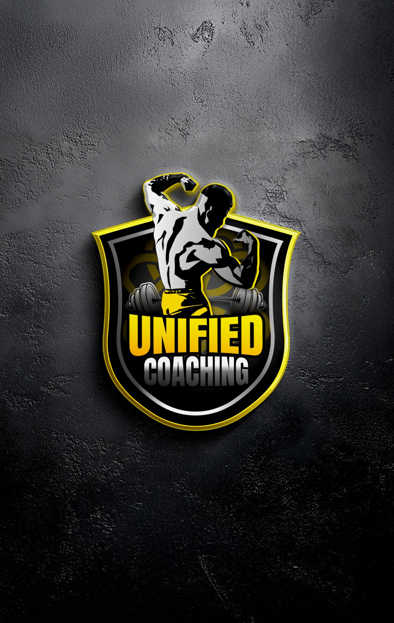 Unified Coaching shield logo mounted on a dark concrete wall
